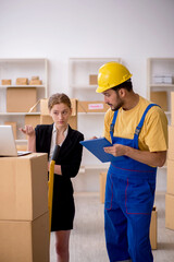 Young female boss and male contractor doing home relocation