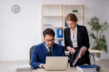 Two colleagues working in the office