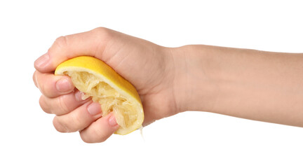 Woman squeezing lemon half on white background, closeup