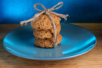 Still life with gingerbread cookies in a blue plate.