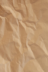 Light brown craft crumpled paper background closeup