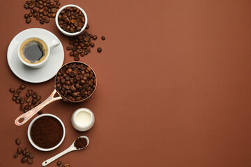 Flat lay composition with ground coffee and roasted beans on brown background, space for text