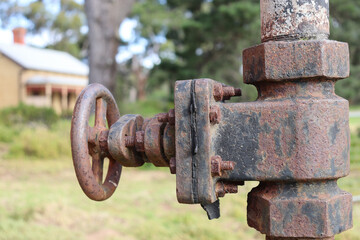 old rusty valve in landscape