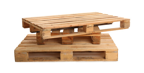 Stacked wooden pallets isolated on white. Transportation and storage