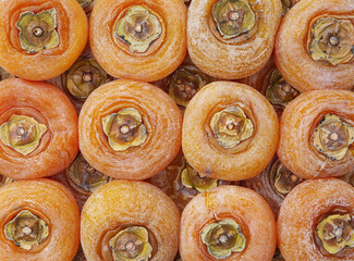 Fototapeta premium Top down view of dried persimmon fill the frame 