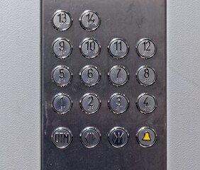 Elevator buttons of a fourteen-story building