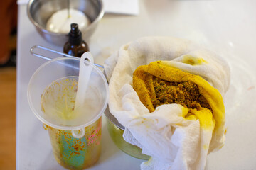 Ingredients being used to make homemade remedial skin care salves and lotions