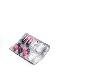 photograph of capsule pills on a white background