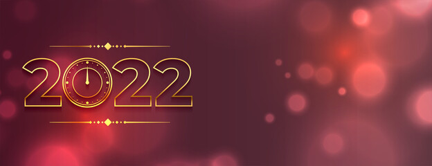 golden 2022 text with bokeh background