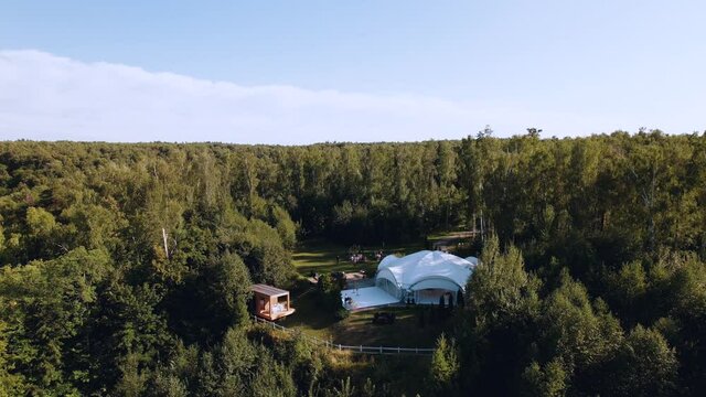 Aerial photography from a quadrocopter - wedding in a tent in nature