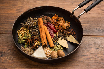 Indian Garam masala powder and colourful spices. selective focus - obrazy, fototapety, plakaty