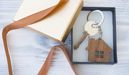 Gift box with a key to the house or apartment