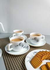 Tea time with Biscuits and dry fruits, White Plan Cashew, and Almonds.
seave in the white marble Tea set. 