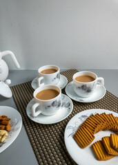Tea time with Biscuits and dry fruits, White Plan Cashew, and Almonds.
seave in the white marble Tea set. 