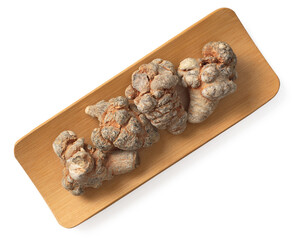 Dried notoginseng in the wooden bowl,  isolated on white background, top view