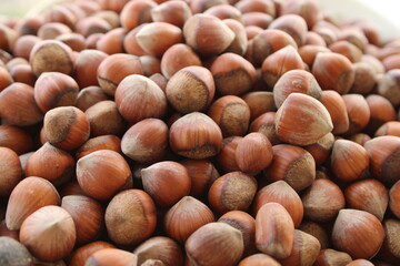 Natural dry hazelnuts close up view, harvested fruits in summer
