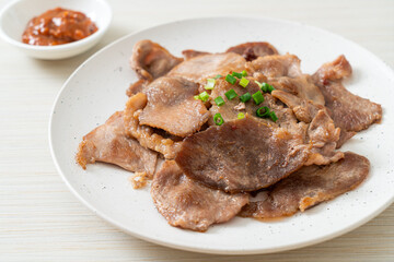 grilled pork neck sliced on plate