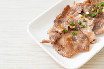 grilled pork neck sliced on plate