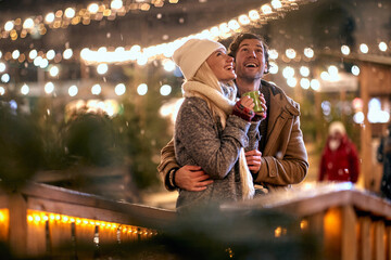 Romantic Christmas night.Man and woman outdoor in winter
