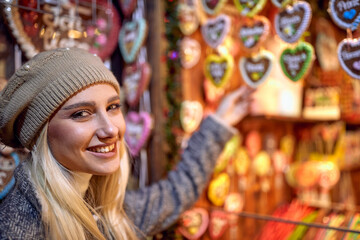 happy girl shopping at festive street market