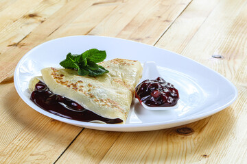 Delicous pancake with fruit jam