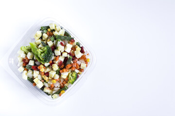 Frozen vegetables in transparent dishes on a light background. The concept of quick-frozen products	