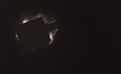outline of a cutting board made of flour on a black background. Copy space