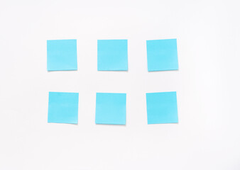 six  blue stickers on a white background