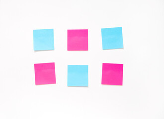 six pink and blue stickers on a white background