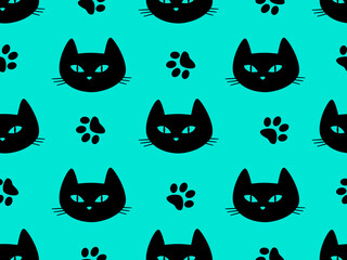Seamless pattern with muzzles of black cats on a blue background.