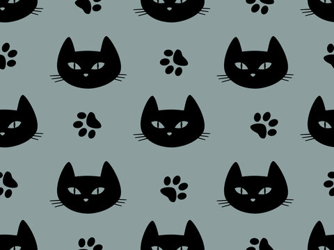 Seamless pattern with black cats' heads on a gray background.