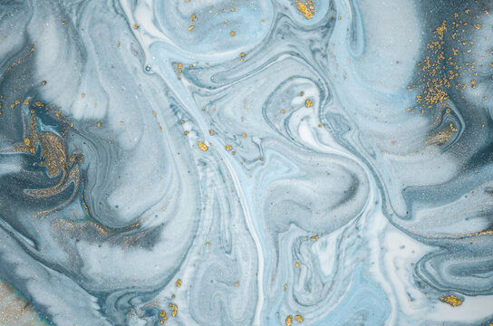 Natural luxury. Tiffany blue. Abstract ocean- ART. Style incorporates the swirls of marble or the ripples of agate. Very beautiful blue paint with the addition of gold powder.	
