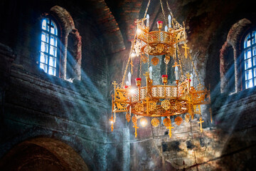 Rays of light in an ancient stone church. The sun's rays in dark stone temple. Lighting effects on...