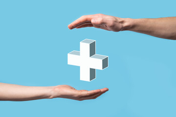 Hand hold 3D plus icon, man hold in hand offer positive thing such as profit, benefits, development, CSR represented by plus sign.The hand shows the plus sign
