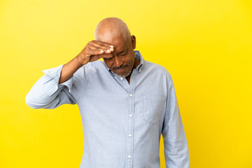 Cuban Senior isolated on yellow background with tired and sick expression