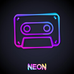 Glowing neon line Retro audio cassette tape icon isolated on black background. Vector