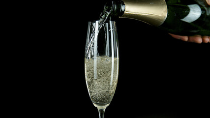 Freeze motion of pouring champagne into flute. Camera movement. Filmed on high speed cinematic...