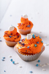 Delicious orange cupcakes made of peaches for fat thursday.