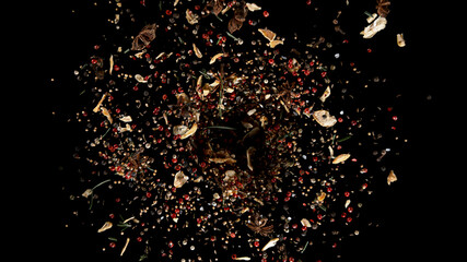 Freeze Motion Shot of Flying Mix Spices. Isolated on Black Background.
