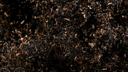 Freeze Motion Shot of Exploding Dry Tea Leaves. Top shot.