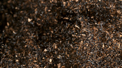 Freeze Motion Shot of Exploding Dry Tea Leaves. Top shot.