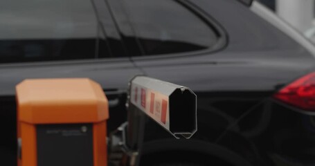 Parking near the shopping center. Close-up shot of a rising and falling barrier allowing cars to pass through