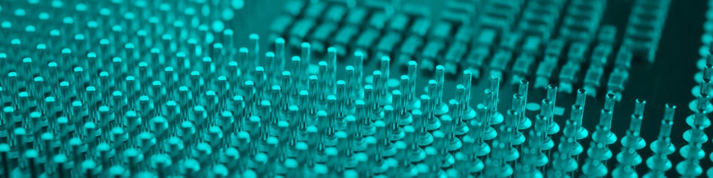 Computer processor close-up. Turquoise tinted banner. Information technology teal headline. A pattern of contacts and semiconductors of a PC microprocessor. Macro