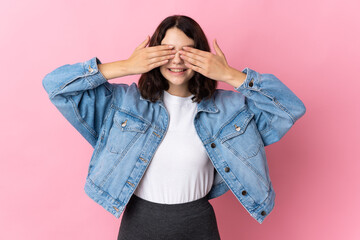 Teenager Ukrainian girl isolated on pink background covering eyes by hands and smiling