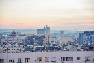 Naklejka premium Belgrade autumn cityscape view with the grey sky above the city during the dusk at the end of the fall and start of the winter time casting the perfect sunset light for the capital city of Serbia