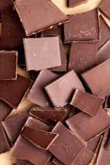 a chocolate bar broken into more pieces