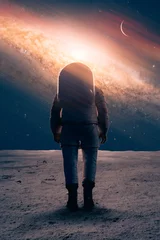 Foto op Canvas a spaceman walking on planet surface with an epic galaxy and stars in the sky. Elements in this image furnished by NASA. 3D rendering. © Jamo Images