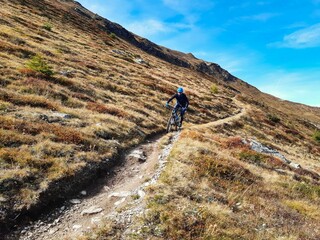 Enduro Trail Ride At Davos Jakobshorn, Swiss Mountains Alps, Sport bicycle at trail path on the mountain at autumn time