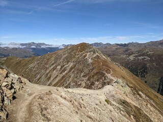 Trail hike ride Path between Jakobshorn and Bramabuel at Davos, Grison, Switzerland, Swiss Alps. Ride Mountainbike fantastic view in the mountains ridge