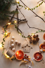 Handmade Christmas tree toys made of natural materials with forest fir tree branch, New Year and Christmas decor concept of eco friendly plastic free materials.